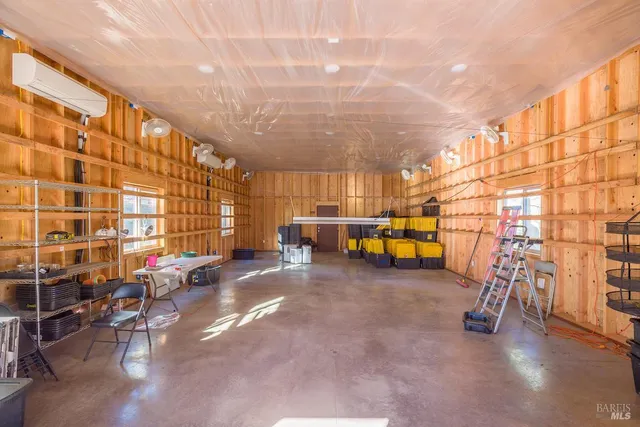 a view of a backyard with swimming pool and deck