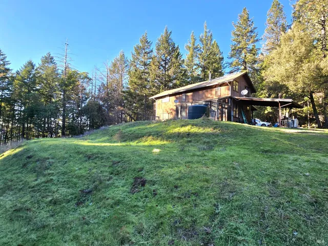 a view of a swimming pool with a yard