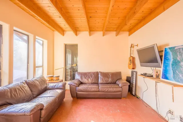 a kitchen that has a stove and a table chair