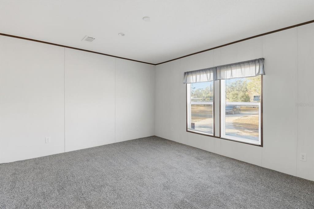 6919 South Sorrell Avenue Homosassa, FL 34446 - Photo 13 of 30 an empty room with windows
