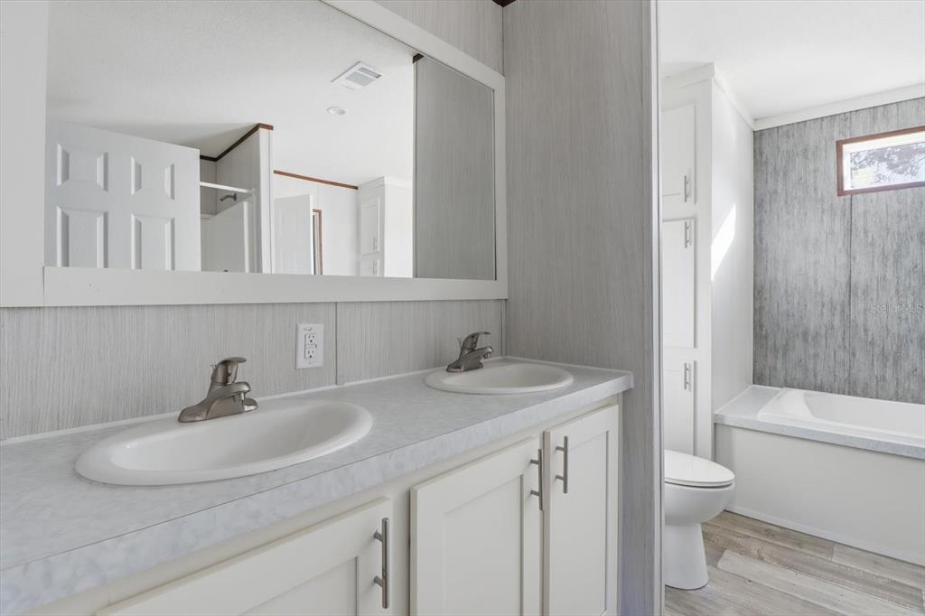 6919 South Sorrell Avenue Homosassa, FL 34446 - Photo 16 of 30 a bathroom with a sink toilet and shower