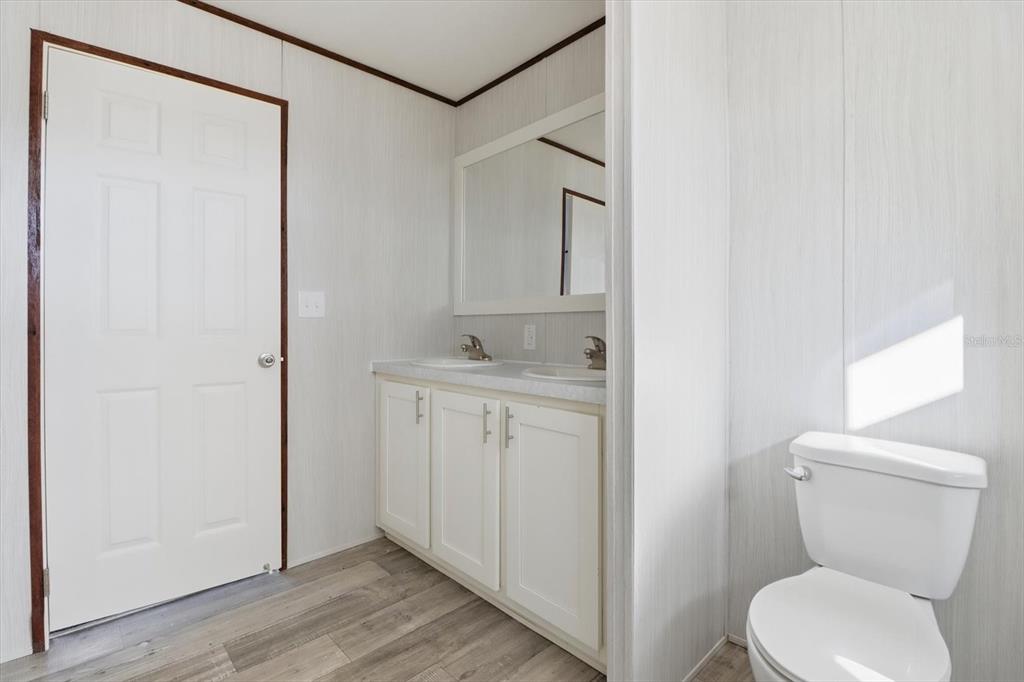 6919 South Sorrell Avenue Homosassa, FL 34446 - Photo 17 of 30 a bathroom with a toilet sink and shower