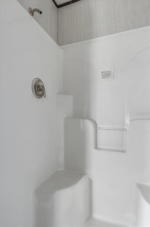 6919 South Sorrell Avenue Homosassa, FL 34446 - Photo 19 of 30 a bathroom with a bathtub