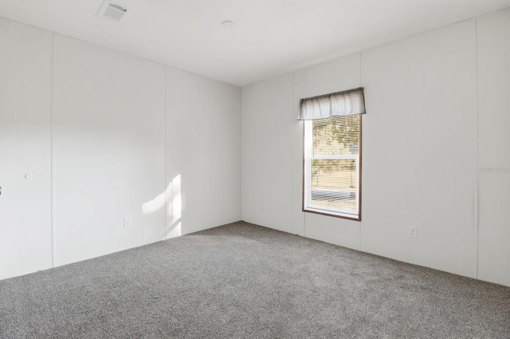 6919 South Sorrell Avenue Homosassa, FL 34446 - Photo 22 of 30 a view of an empty room with a window