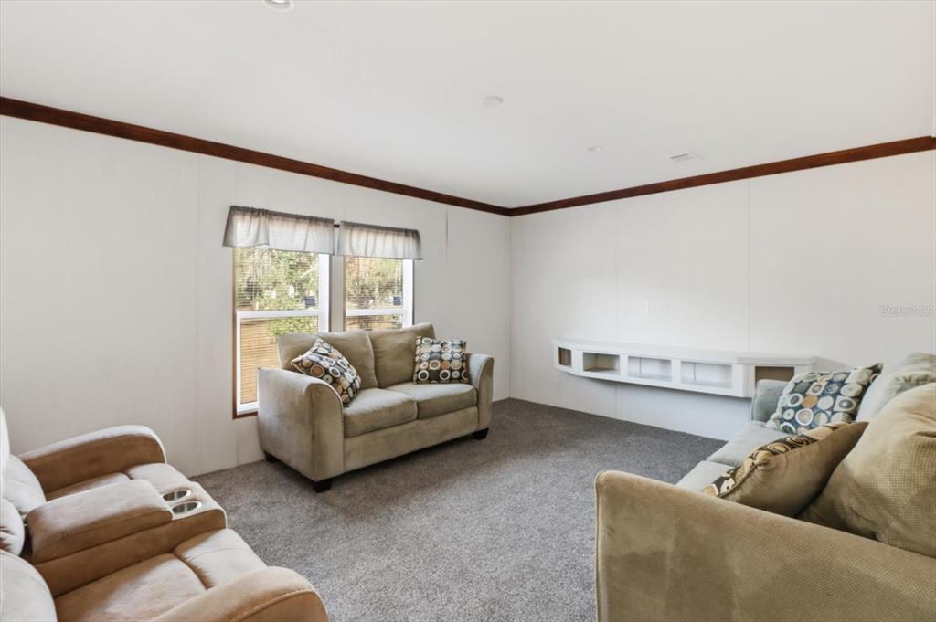 6919 South Sorrell Avenue Homosassa, FL 34446 - Photo 24 of 30 a living room with furniture and a window