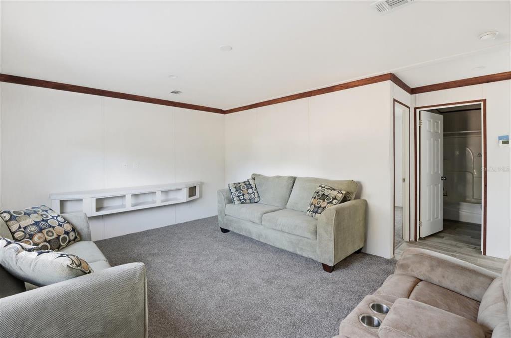 6919 South Sorrell Avenue Homosassa, FL 34446 - Photo 25 of 30 a living room with furniture and a couch