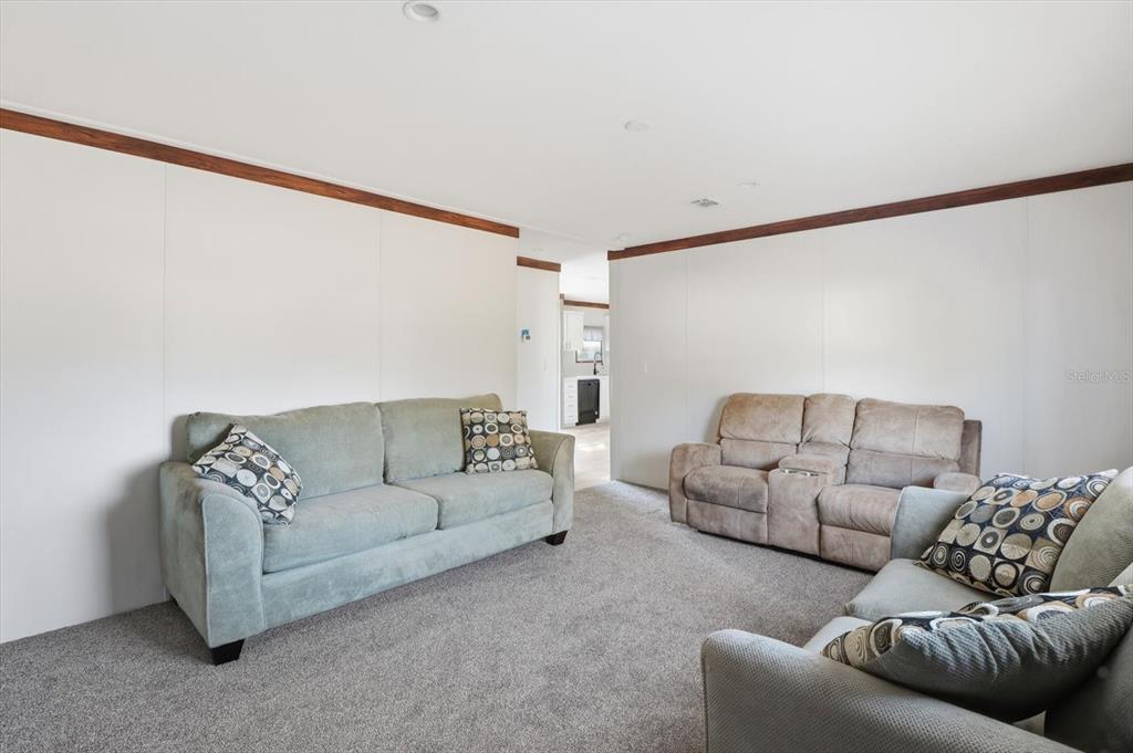 6919 South Sorrell Avenue Homosassa, FL 34446 - Photo 26 of 30 a living room with furniture and a couch