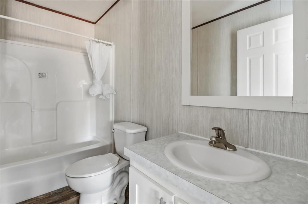 6919 South Sorrell Avenue Homosassa, FL 34446 - Photo 27 of 30 a bathroom with a sink toilet and shower