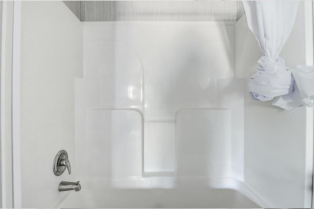6919 South Sorrell Avenue Homosassa, FL 34446 - Photo 28 of 30 a bathroom with a shower