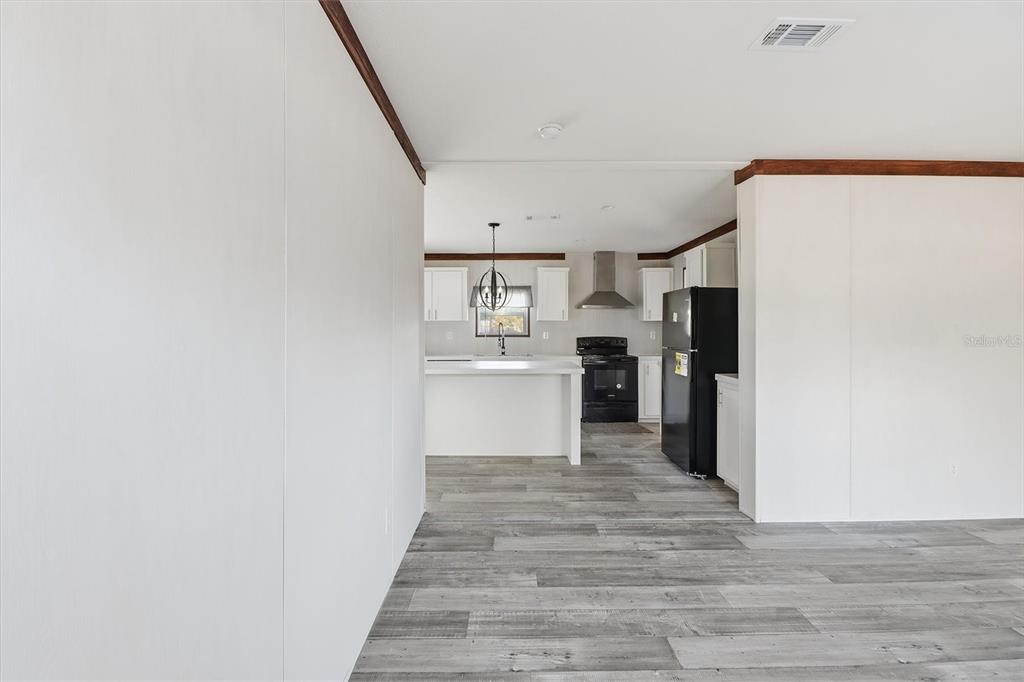 6919 South Sorrell Avenue Homosassa, FL 34446 - Photo 3 of 30 a view of kitchen with wooden floor