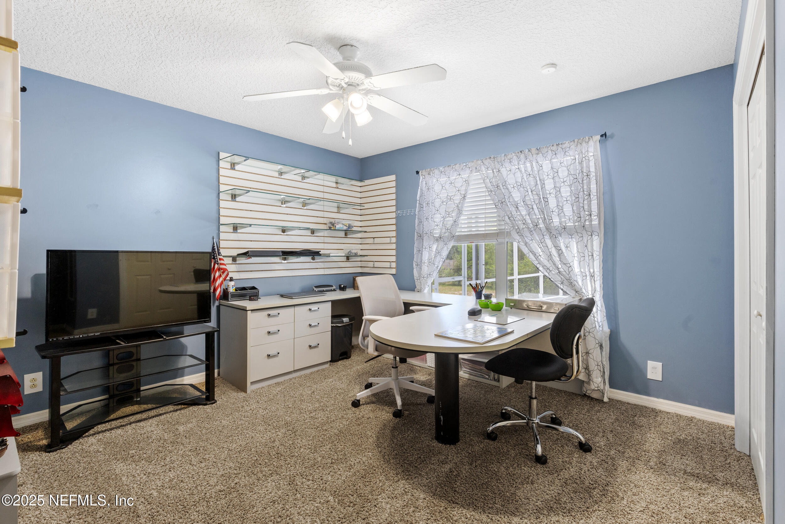 7557 Alameda Way Keystone Heights, FL 32656 - Photo 17 of 40 a view of a workspace with furniture and a window