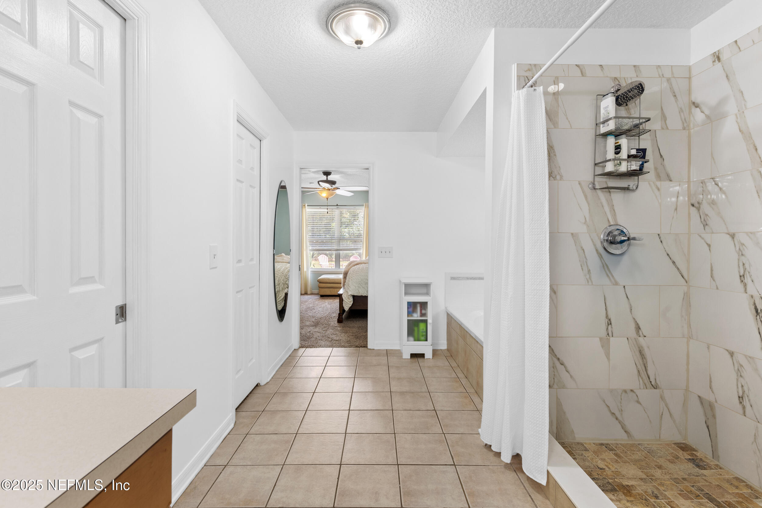 7557 Alameda Way Keystone Heights, FL 32656 - Photo 20 of 40 a bathroom with a sink and a shower