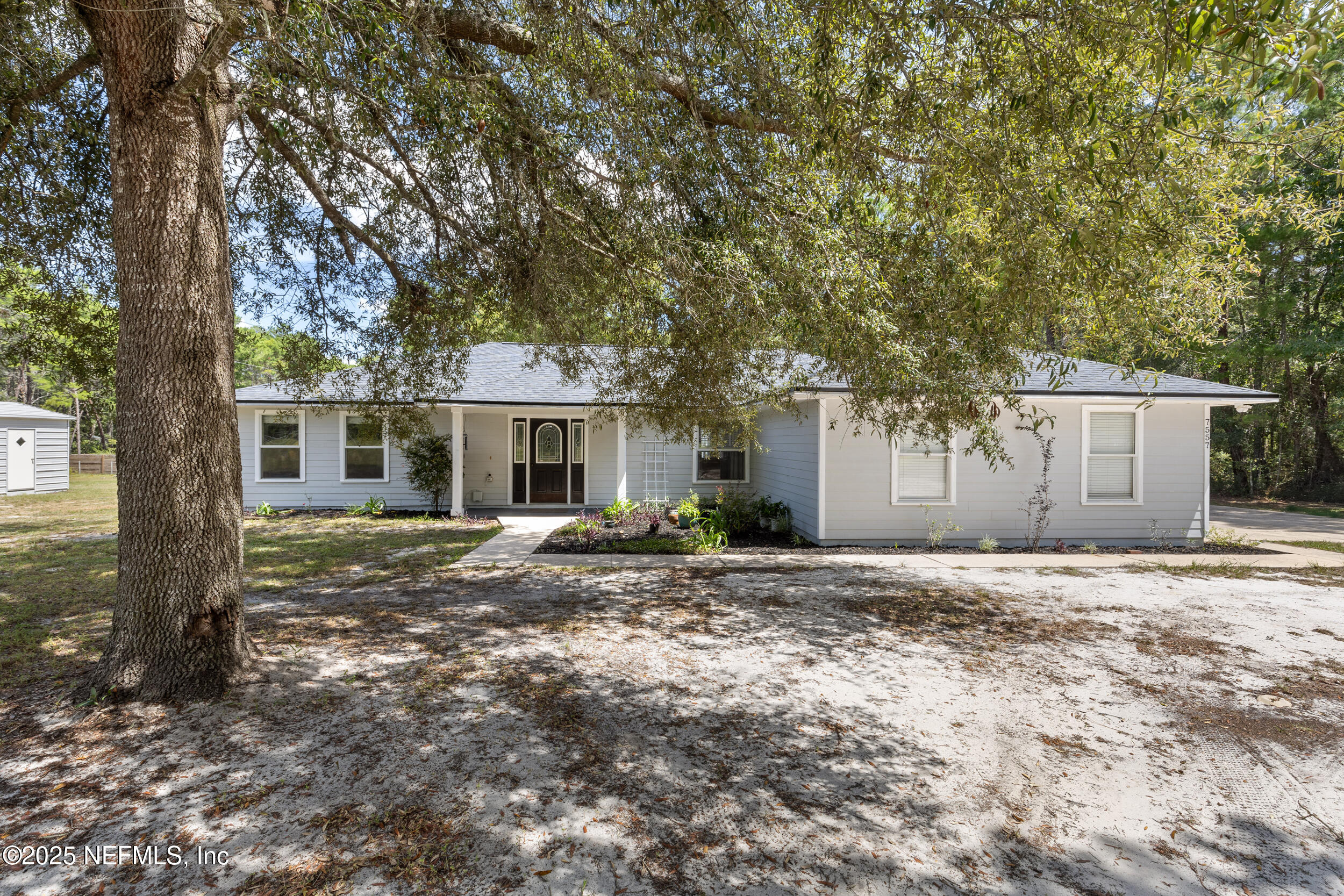 7557 Alameda Way Keystone Heights, FL 32656 - Photo 2 of 40 a view of a house with a yard