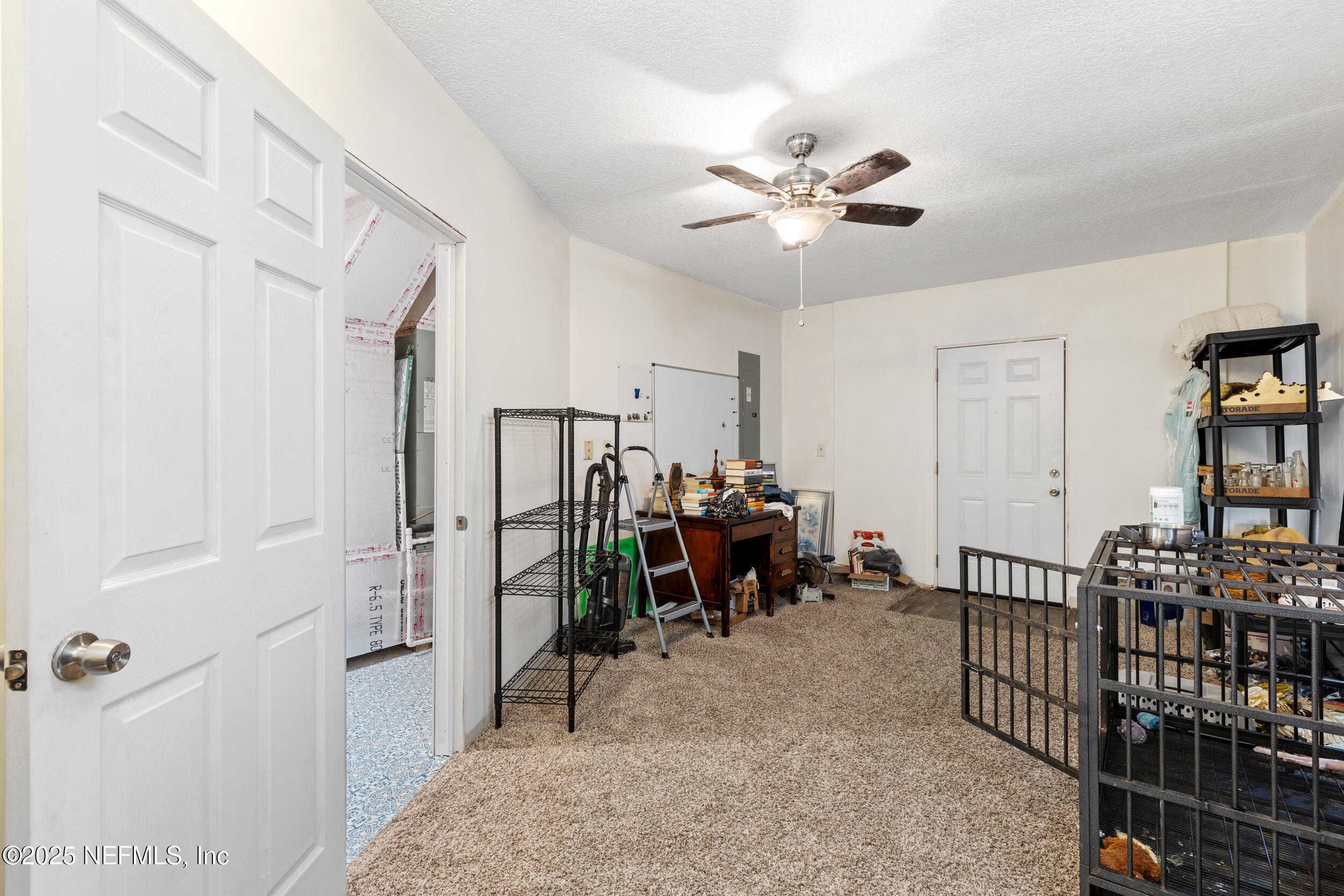 7557 Alameda Way Keystone Heights, FL 32656 - Photo 24 of 40 a view of a livingroom with furniture and a fan