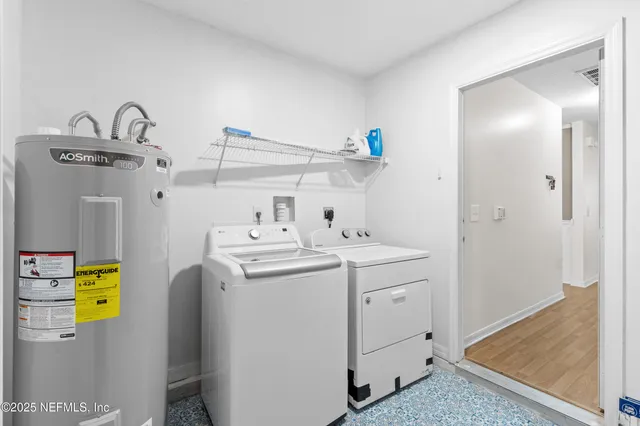 a utility room with dryer and washer