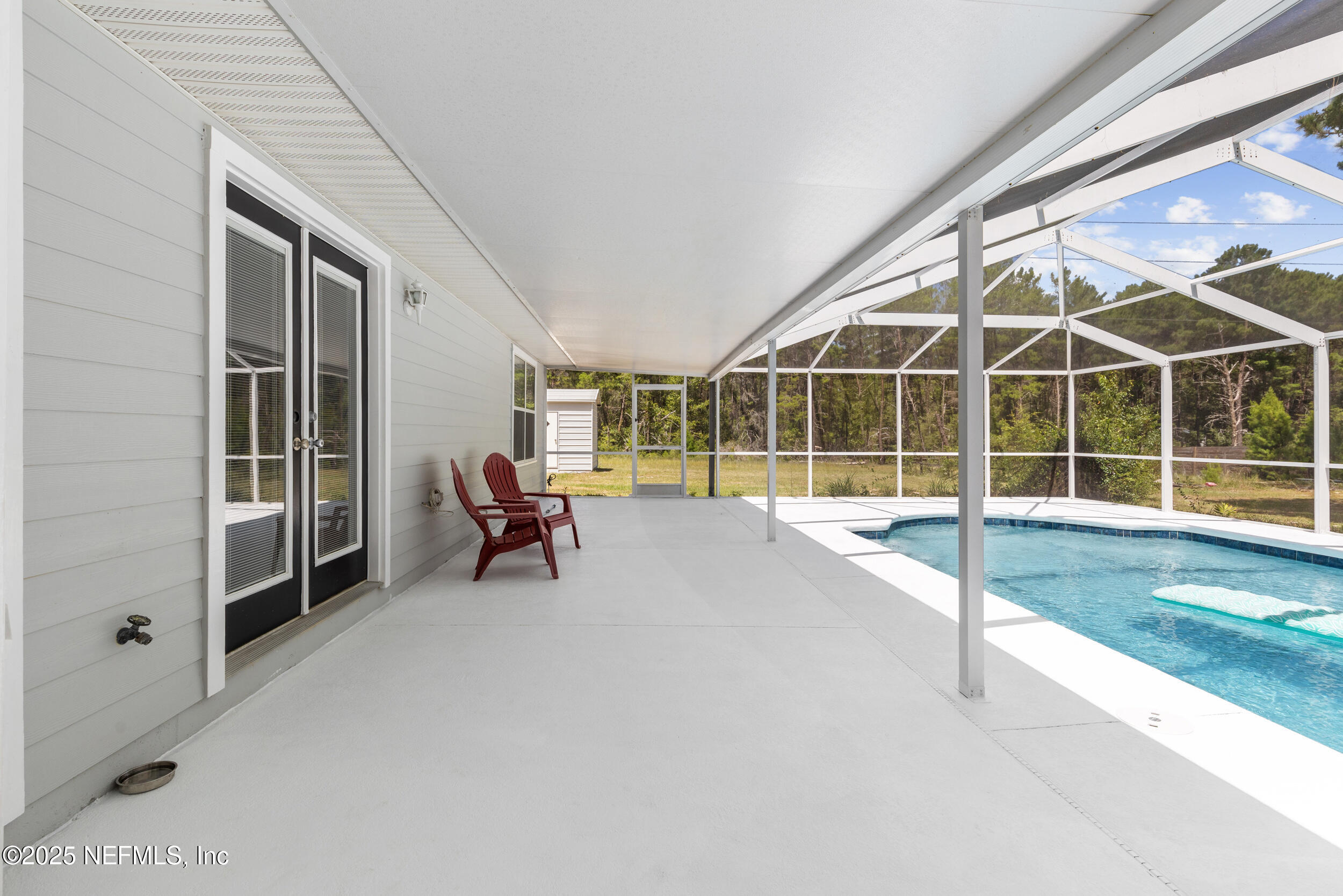 7557 Alameda Way Keystone Heights, FL 32656 - Photo 26 of 40 a view of house with porch and outdoor space