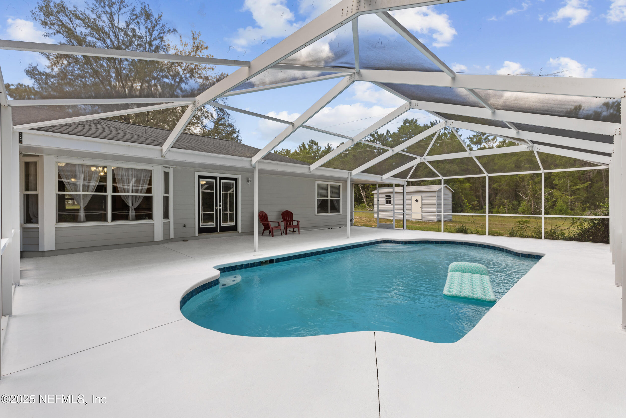 7557 Alameda Way Keystone Heights, FL 32656 - Photo 28 of 40 a view of a house with pool