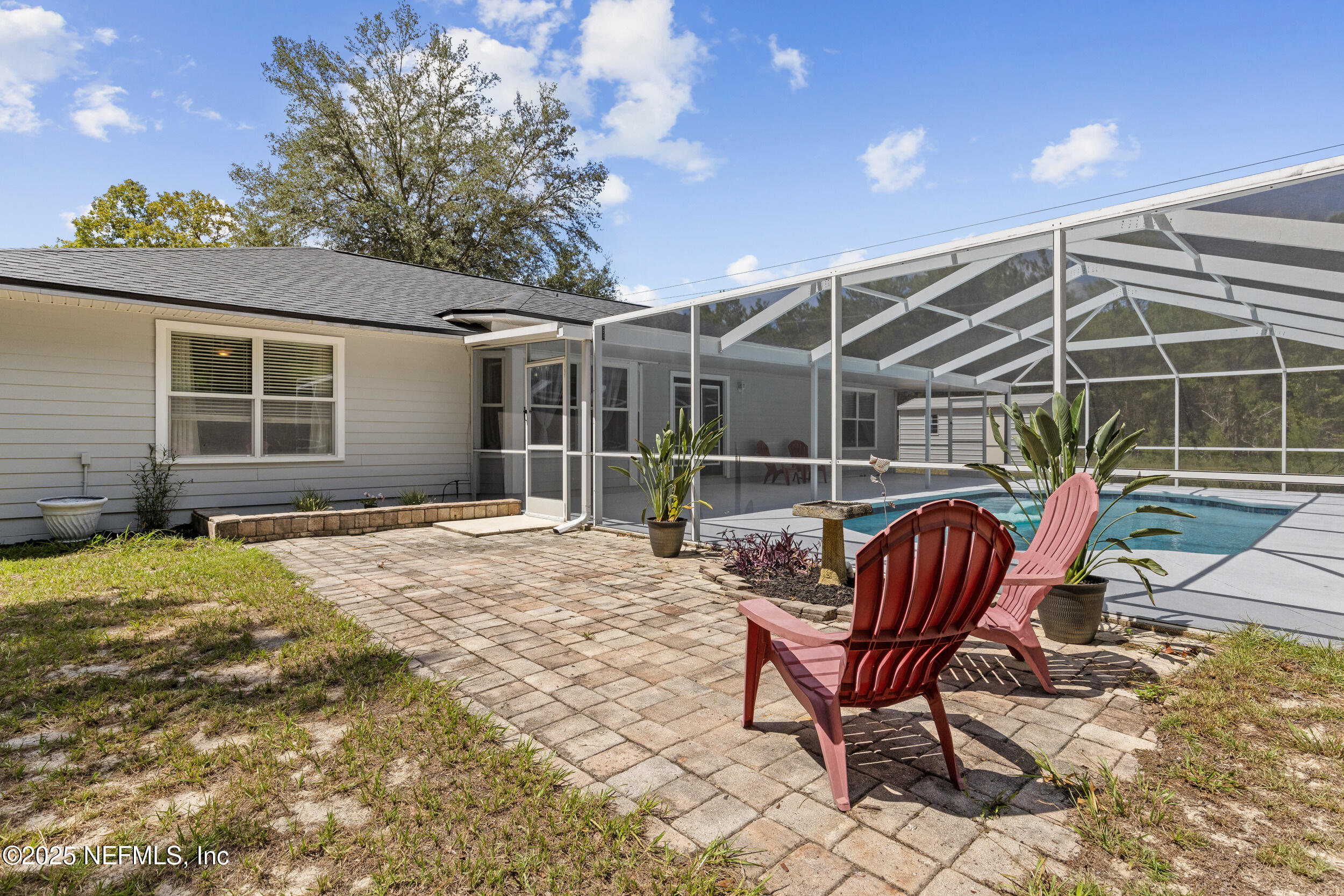 7557 Alameda Way Keystone Heights, FL 32656 - Photo 30 of 40 a view of a lounge chairs in the patio