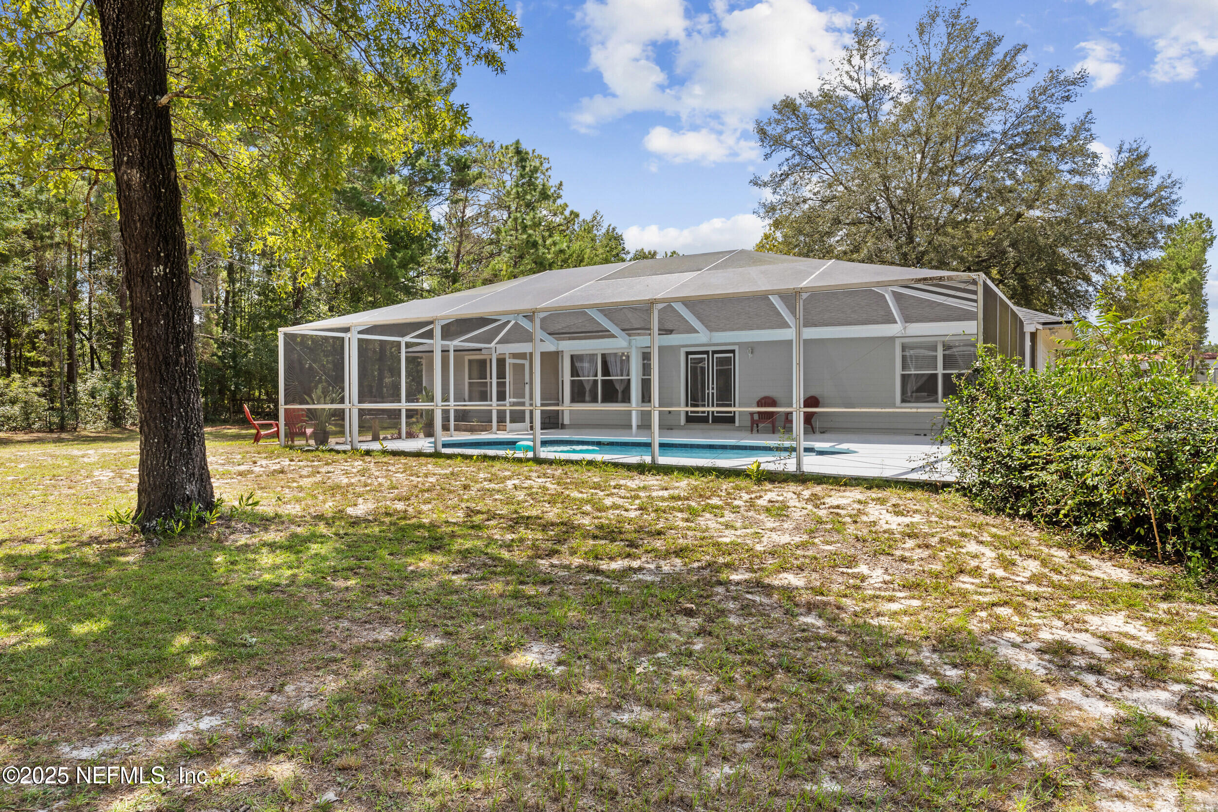 7557 Alameda Way Keystone Heights, FL 32656 - Photo 32 of 40 a house with trees in the background