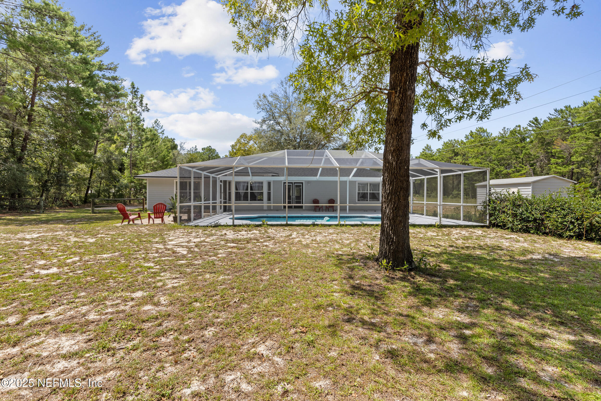 7557 Alameda Way Keystone Heights, FL 32656 - Photo 33 of 40 a house with swimming pool in front of it