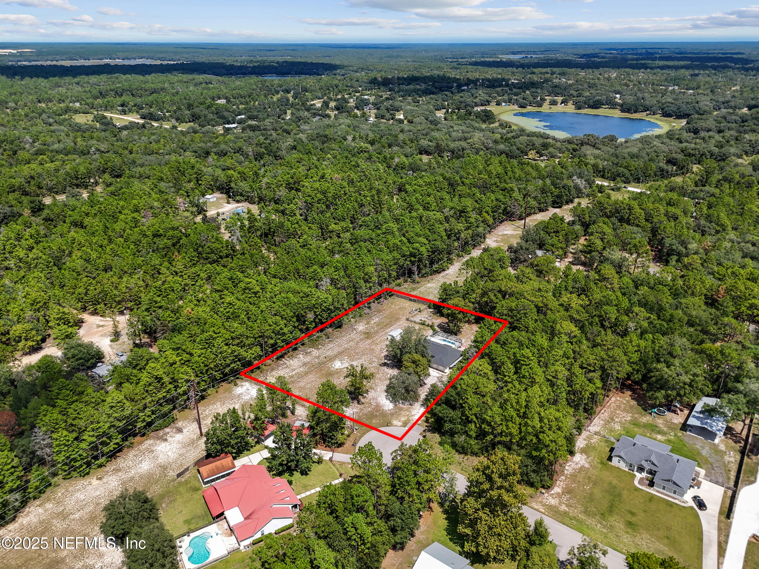 7557 Alameda Way Keystone Heights, FL 32656 - Photo 38 of 40 an aerial view of a house with a yard
