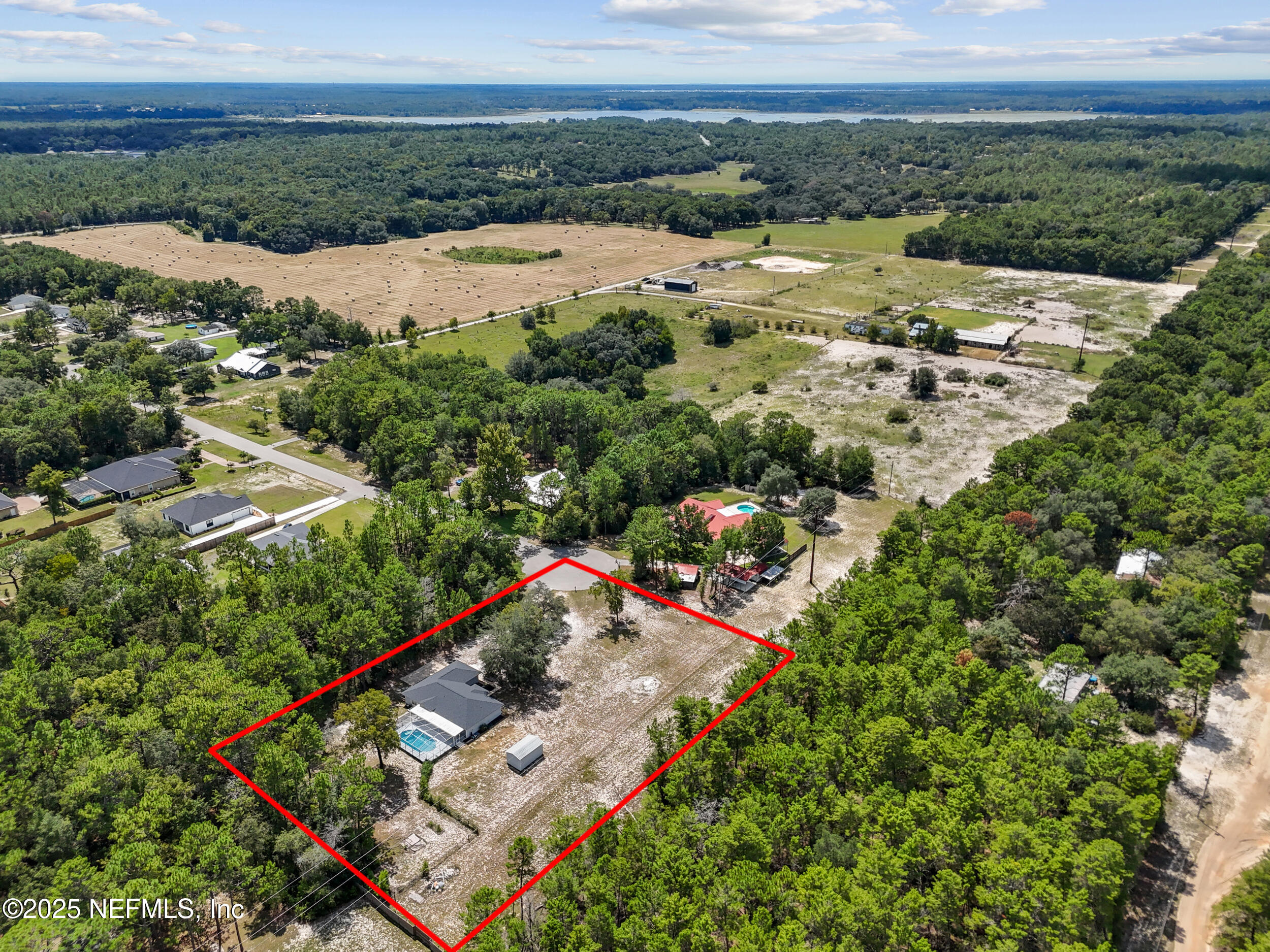 7557 Alameda Way Keystone Heights, FL 32656 - Photo 40 of 40 an aerial view of residential houses with outdoor space and river
