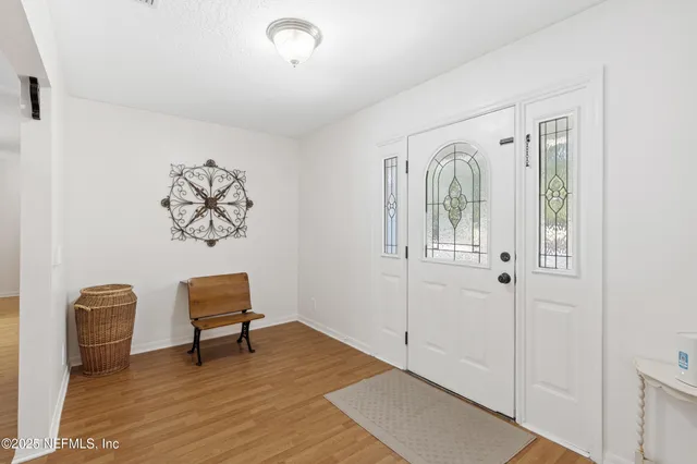 a view of a livingroom with workspace and a couch