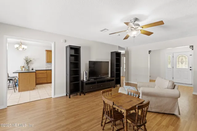 a view of a livingroom with furniture and wooden floor