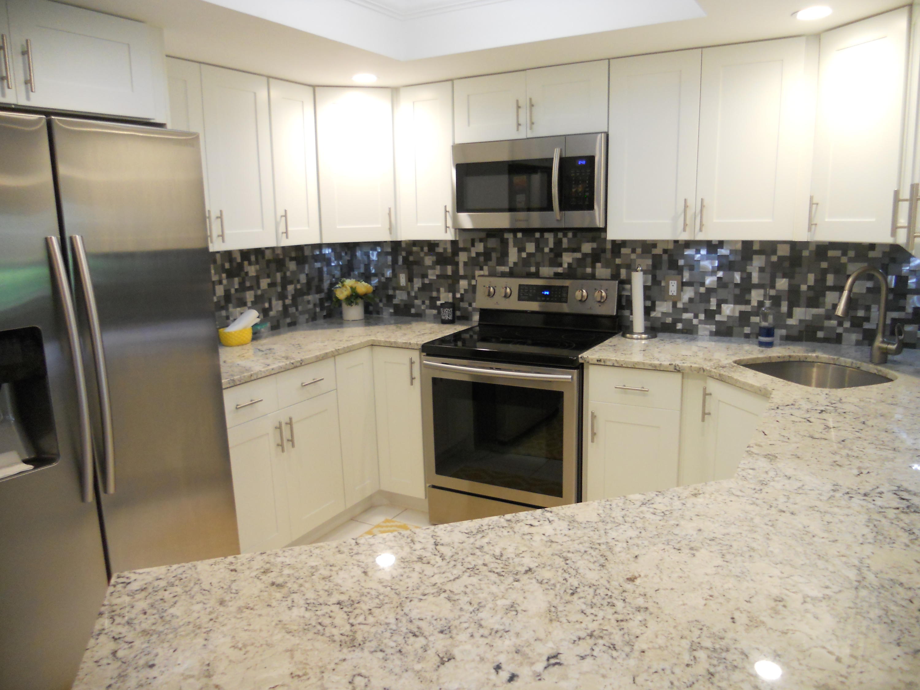 a kitchen with a stove microwave and refrigerator