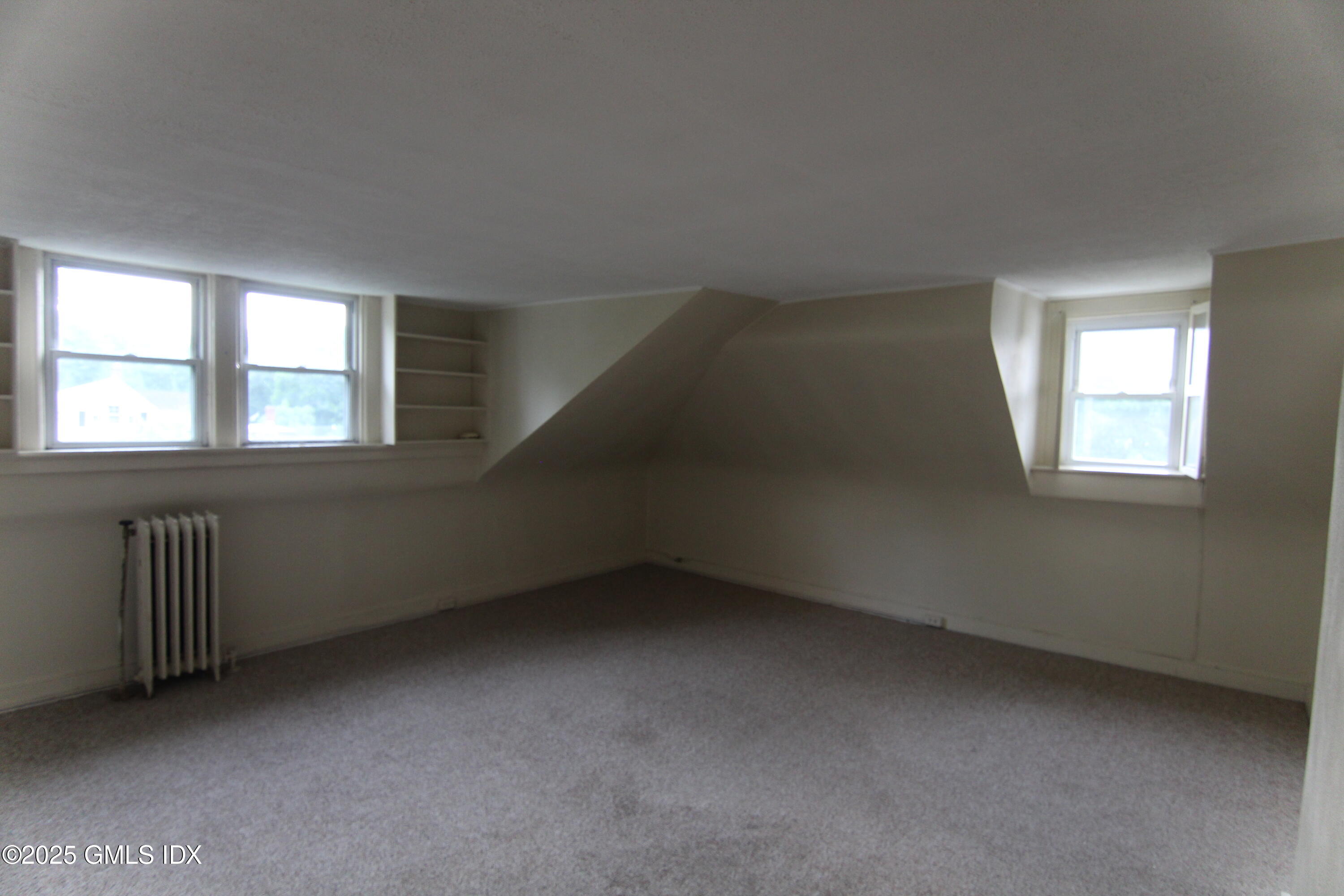 90 Riverside Avenue, Unit 5 Riverside, CT 06878 - Photo 3 of 13 an empty room with a window