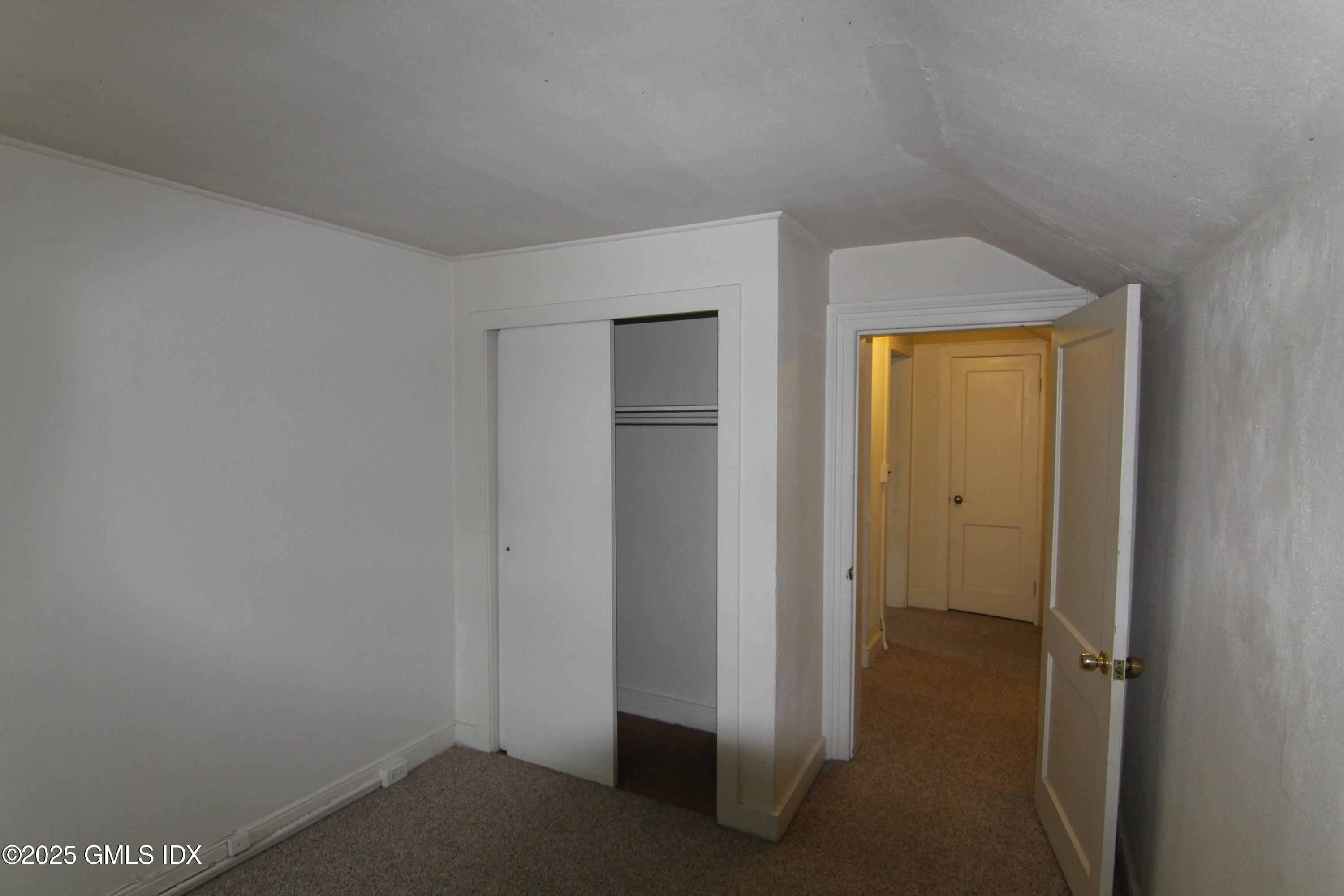 90 Riverside Avenue, Unit 5 Riverside, CT 06878 - Photo 10 of 13 a view of a hallway with closet area