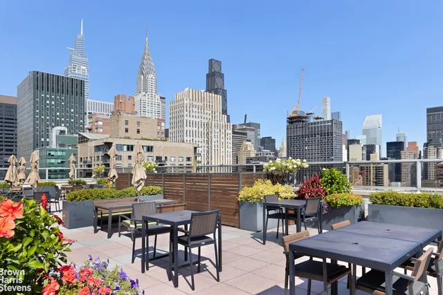 a view of a swimming pool with outdoor seating
