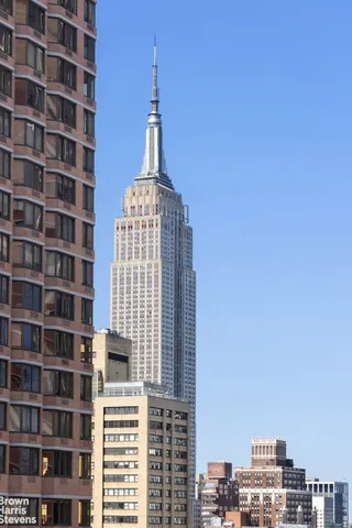 a bathroom with a sink a mirror and a window