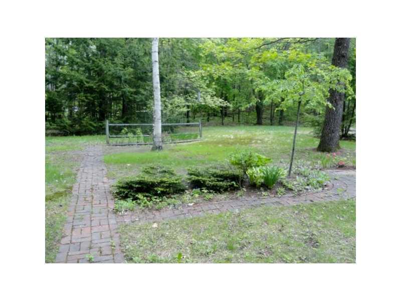 327 Webber Road North Waterboro, ME 04061 - Photo 7 of 25 Exterior Front. Brick paths lead to...