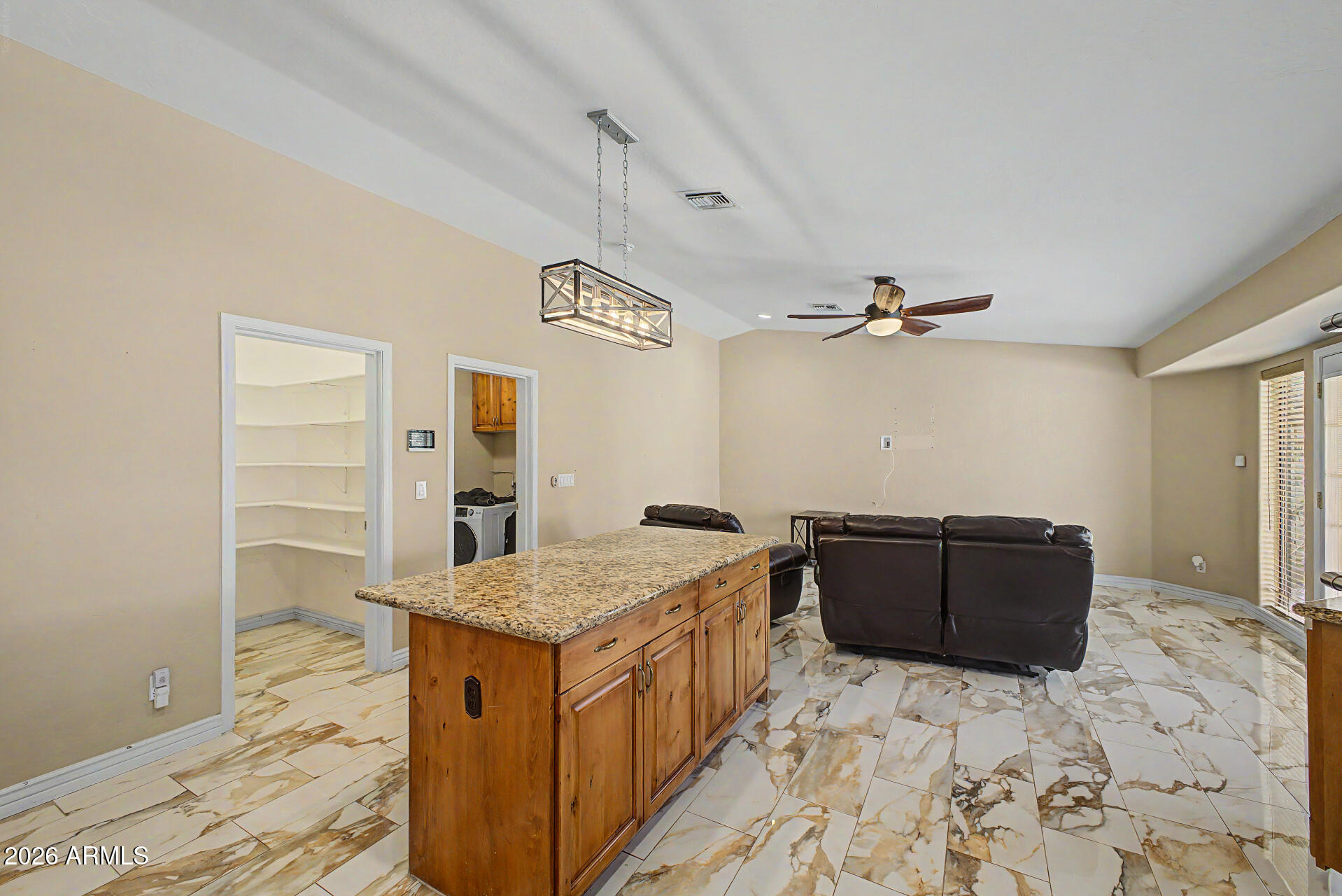 802 East Roberts Road Phoenix, AZ 85022 - Photo 7 of 24 a living room with a dresser and chandelier