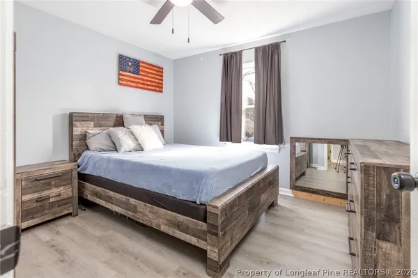 a bedroom with a bed and a couch