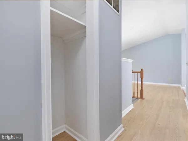 a view of a hallway with a room