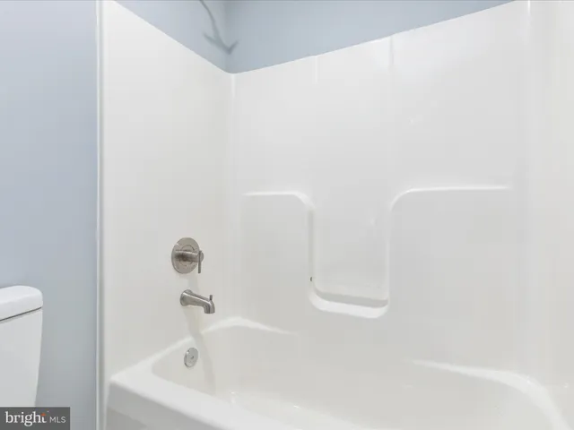 a bathroom with a white bath tub