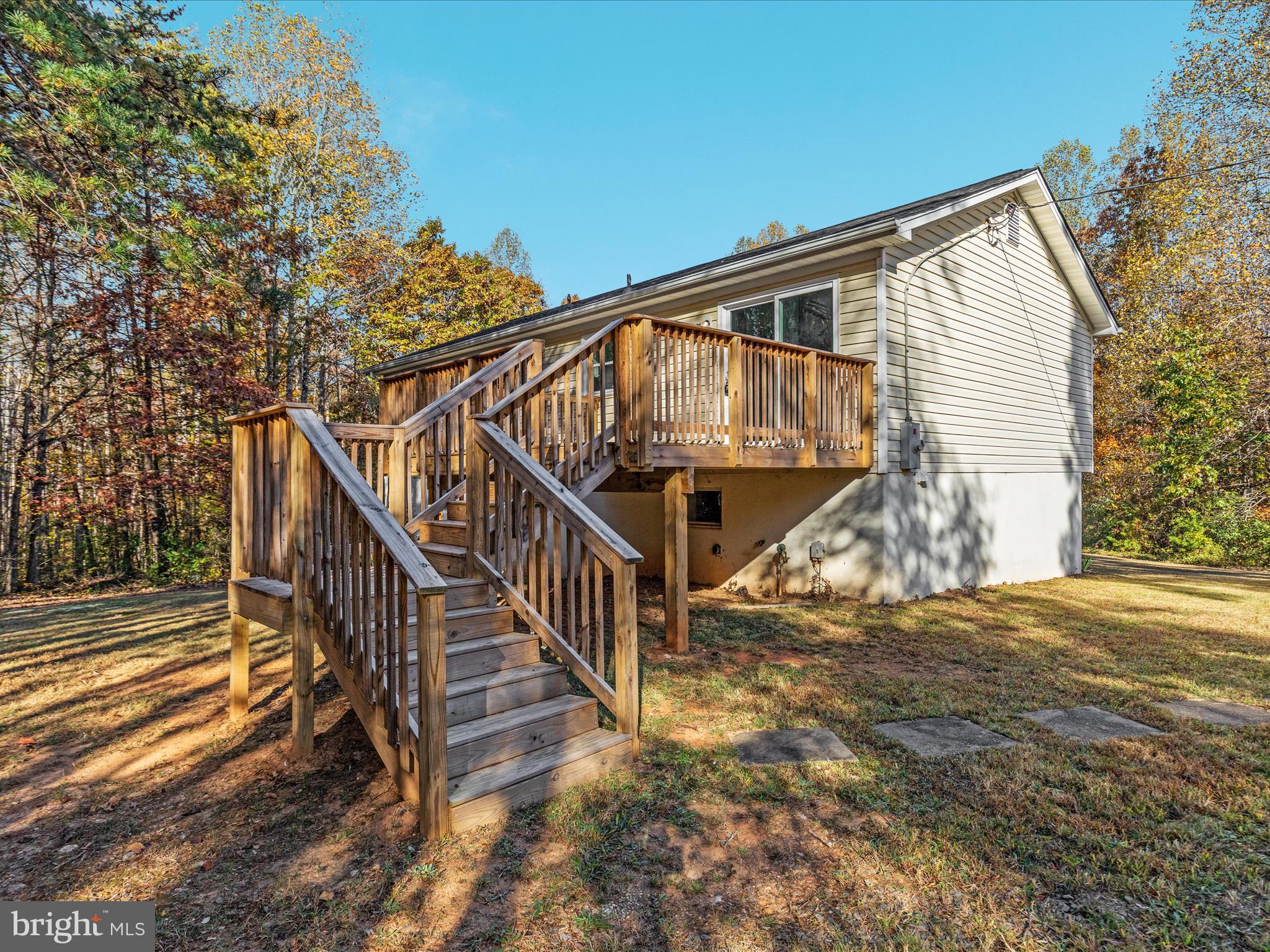 10214 Unique Trail Rixeyville, VA 22737 - Photo 38 of 48 a view of a house with wooden floor next to a road