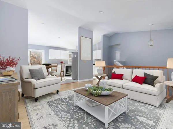 a living room with furniture and a rug