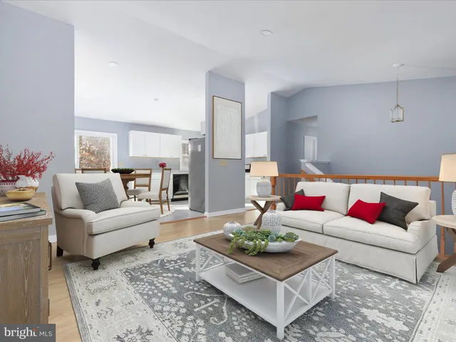 a living room with furniture and a rug