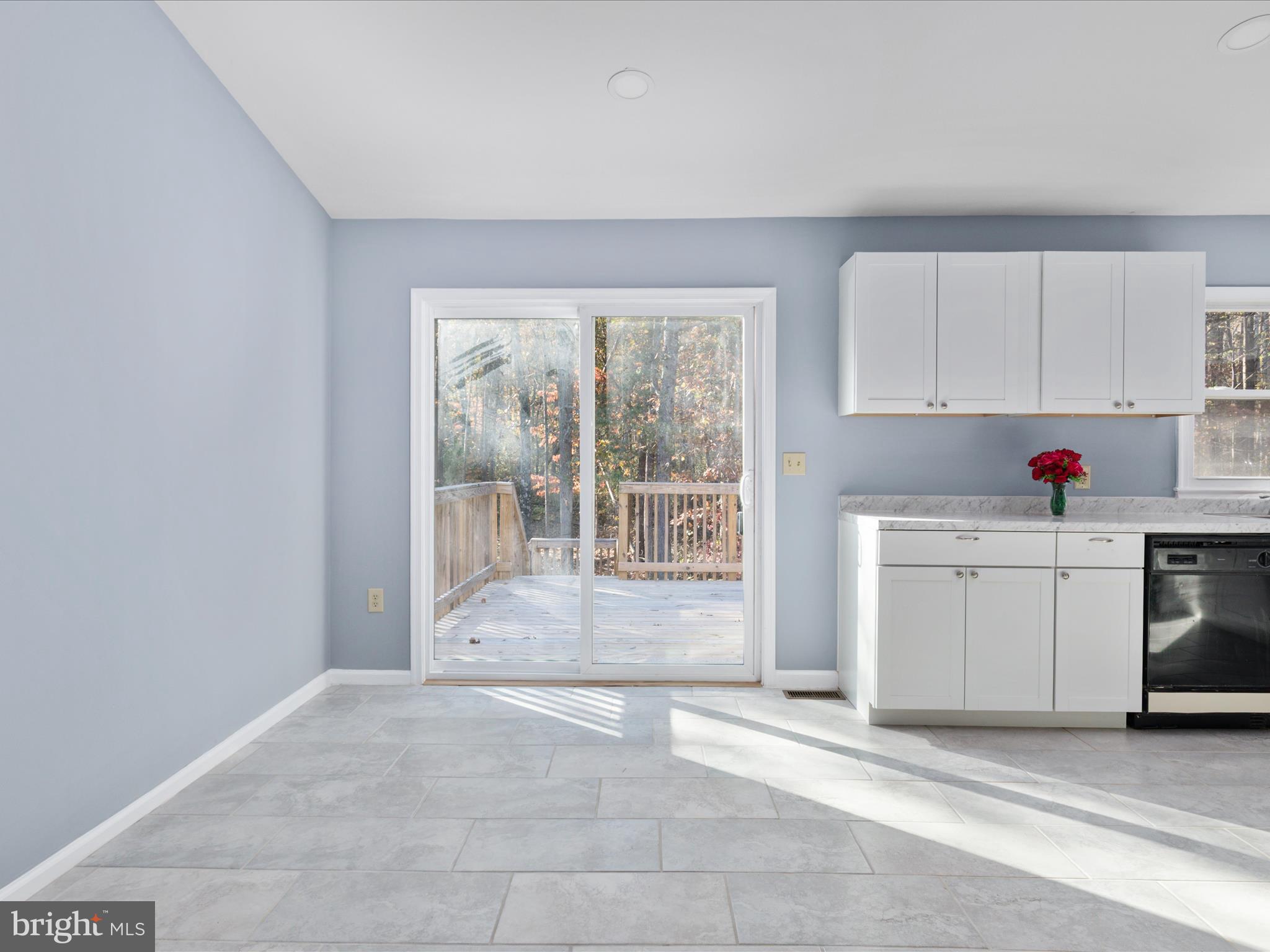10214 Unique Trail Rixeyville, VA 22737 - Photo 8 of 48 a view of a kitchen with wooden floor and electronic appliances