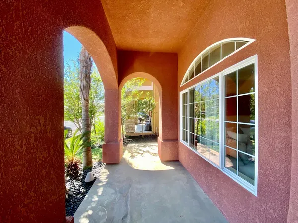 a view of front door and porch with seating space