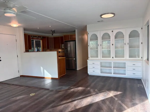 a kitchen with stainless steel appliances granite countertop a refrigerator and a sink