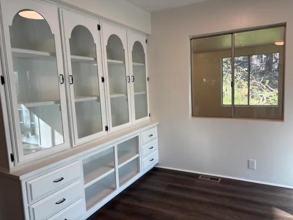 a kitchen with stainless steel appliances granite countertop a refrigerator a sink and a stove