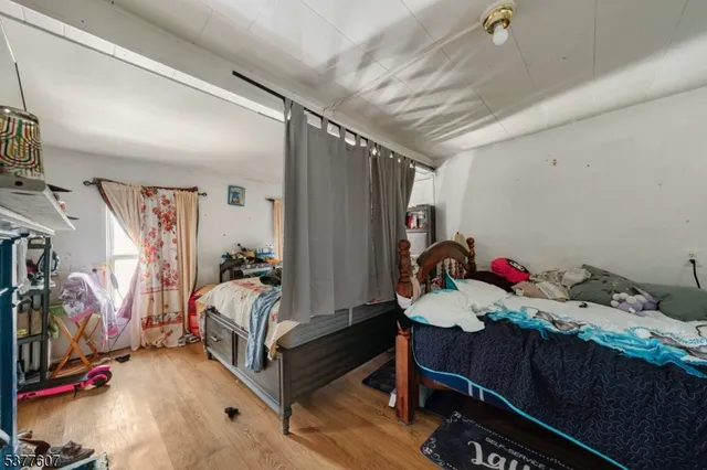 a bed room with a bed and a desk