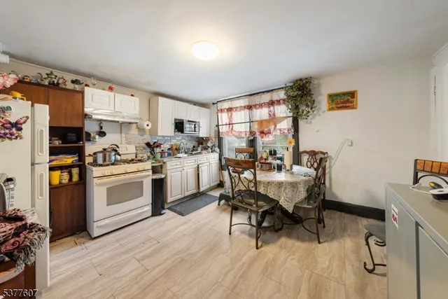 a workspace with furniture window and wooden floor