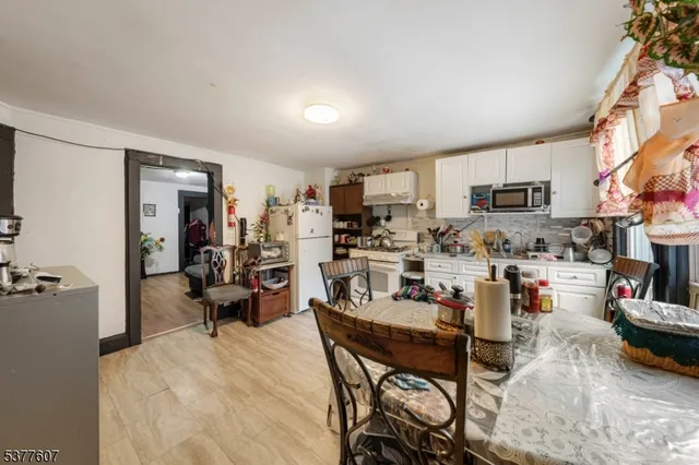 a living room with lots of furniture and a wooden floor