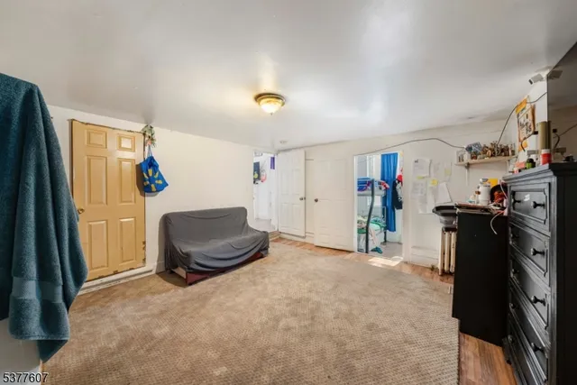 a view of a livingroom with furniture and a window