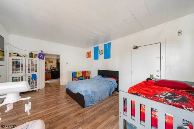 a living room with furniture and book shelf